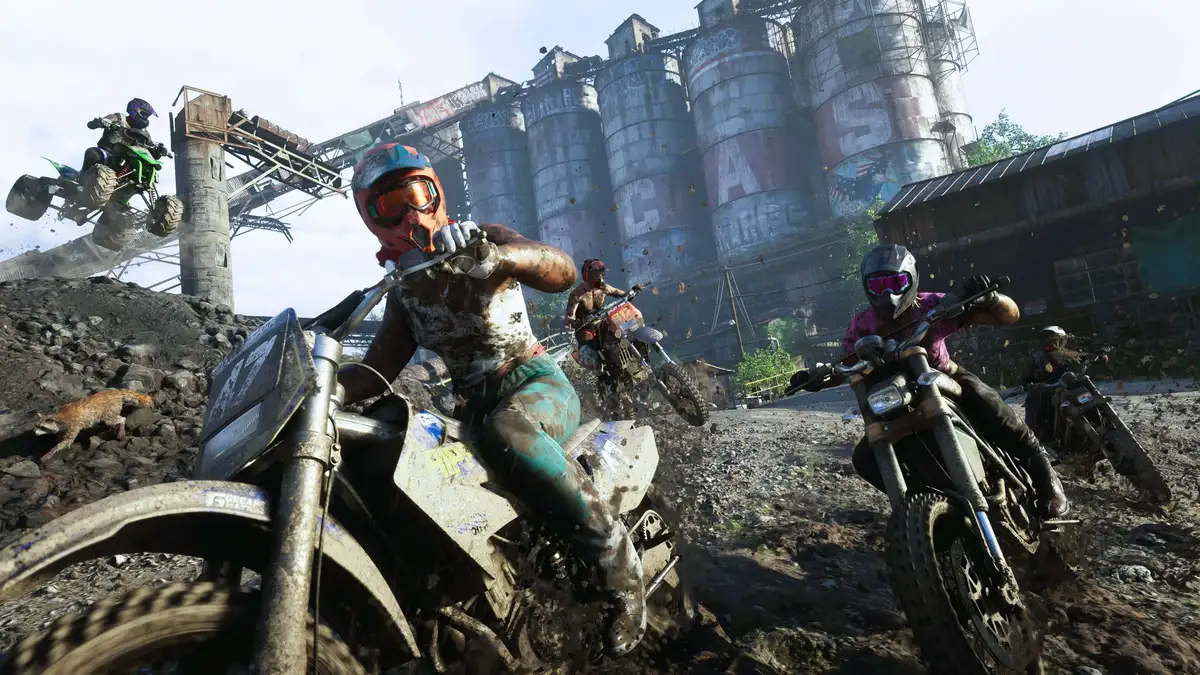 GTA 6 characters racing dirt bikes through a muddy off-road track in rural Leonida.